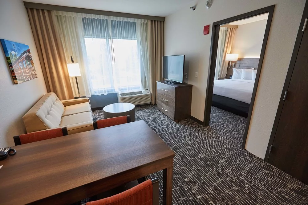 Gundersen Hotel and Suites - Our one bedroom suites offer 504 square feet of space with a separate bedroom, full kitchen and island style eating area.